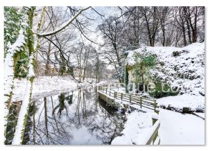 A Christmas card featuring a photo by Charlotte Gale of Mother Shiptons Cave & Dropping Well in the snow
