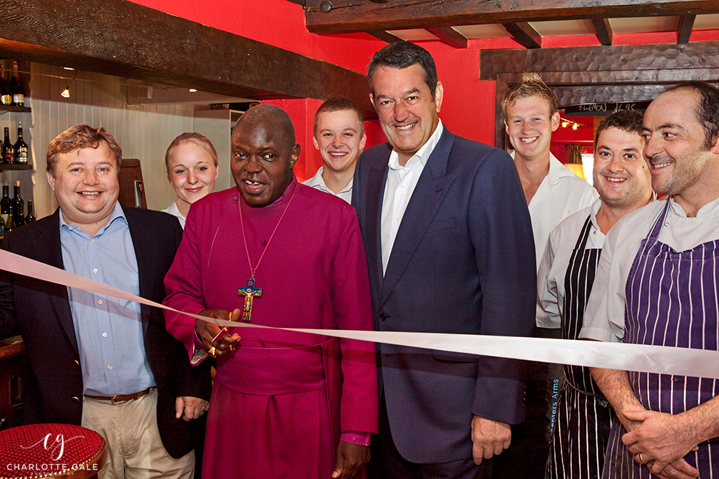 A photograph of the Archbishop of York, Dr John Sentamu opening the Carpenter’s Arms in Felixkirk, North Yorkshire